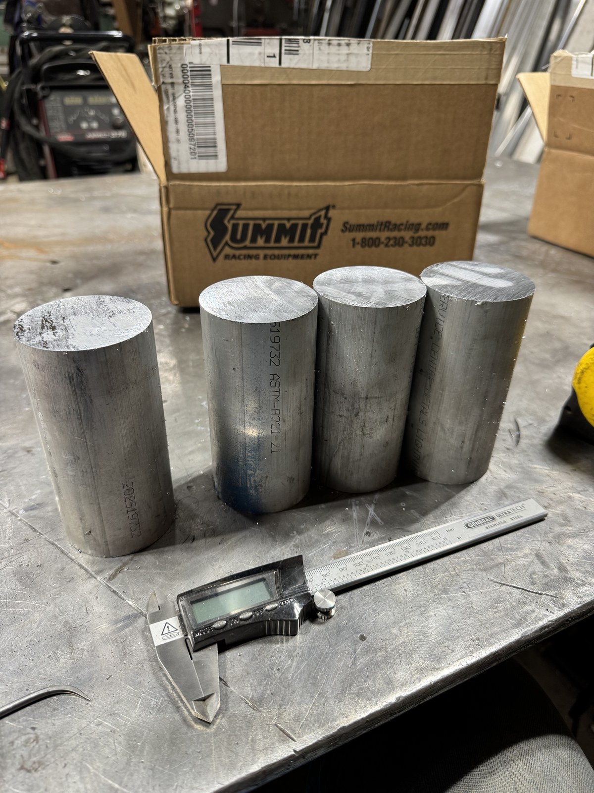 Round 6061 aluminum bar stock from Service Center Metals, prepared for spindle and hub machining